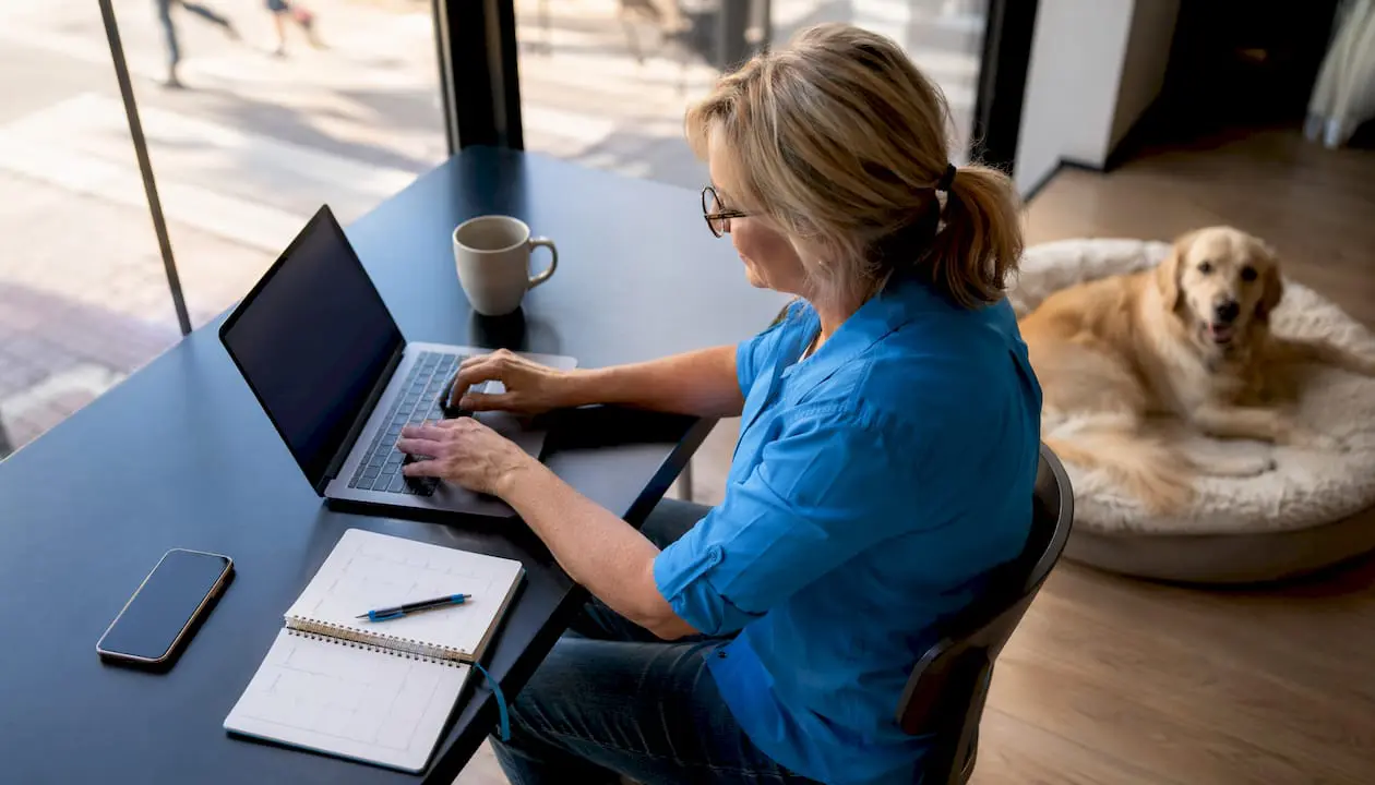 Person working on dog daycare software at home