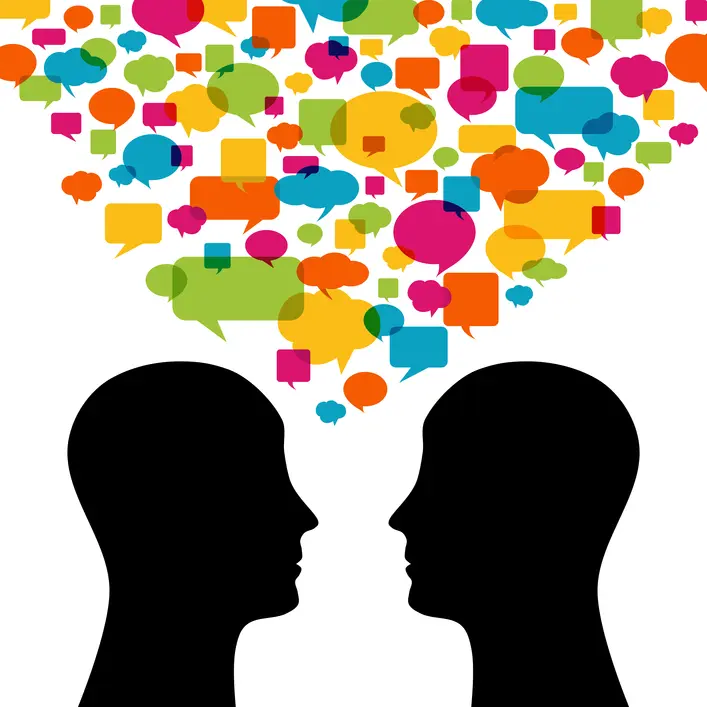 Graphic of two people talking with lots of yellow, orange, blue, green, and pink speech bubbles floating above them.