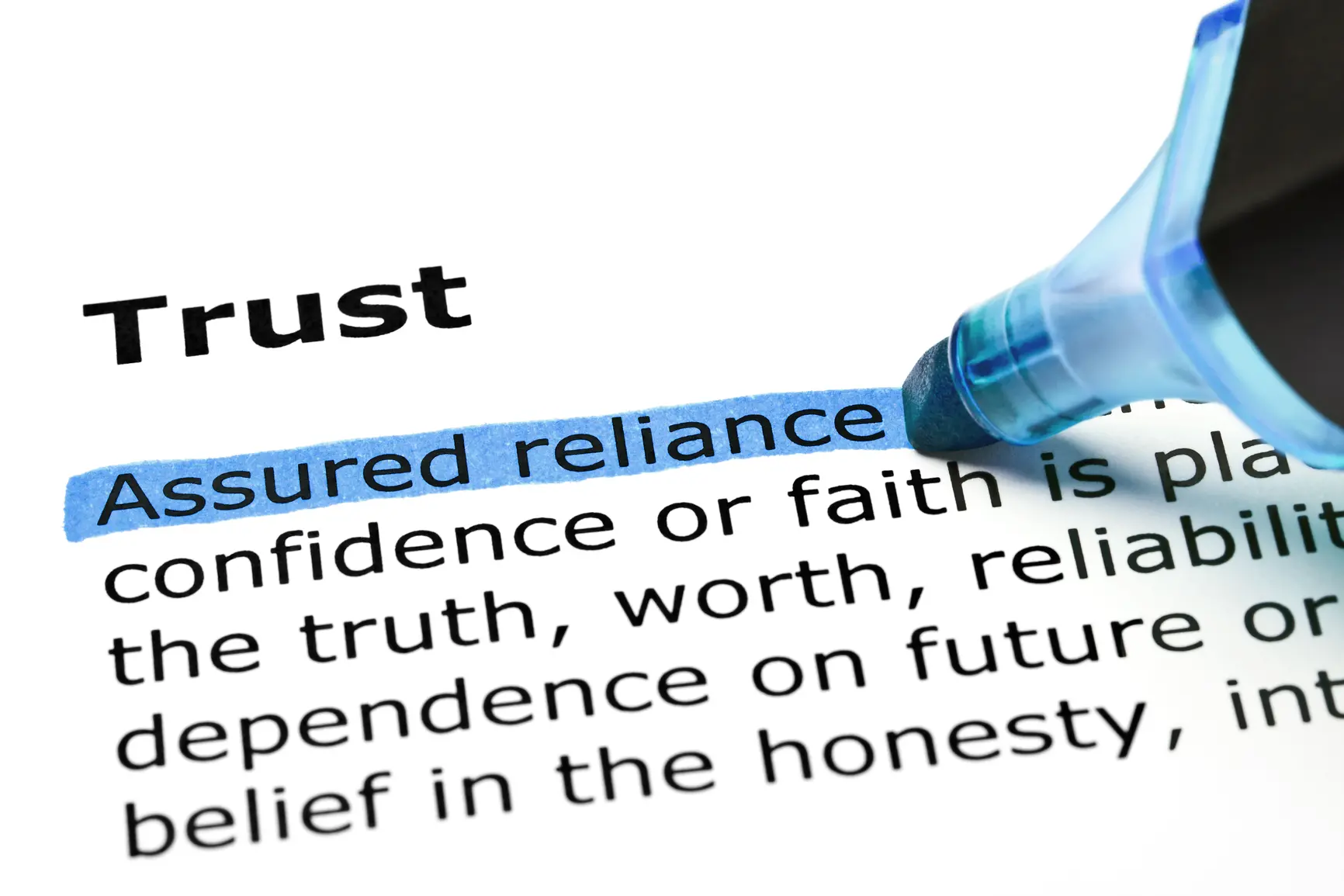 The definition of the bolded word "Trust" with a blue highlighter noting, "Assured reliance."