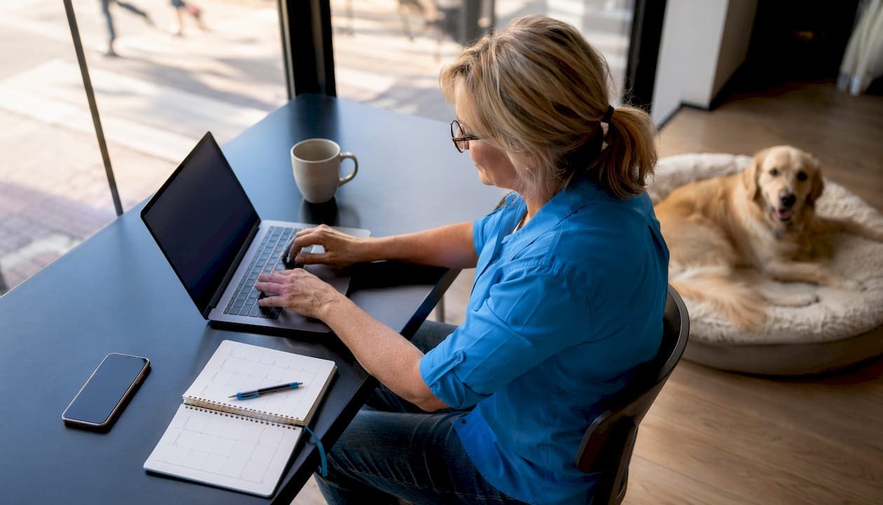 Person working on dog daycare software at home