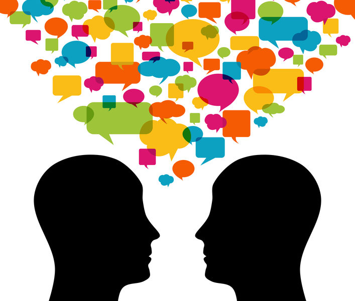 Graphic of two people talking with lots of yellow, orange, blue, green, and pink speech bubbles floating above them.