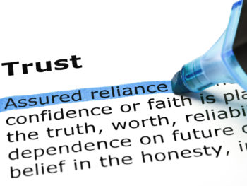The definition of the bolded word "Trust" with a blue highlighter noting, "Assured reliance."