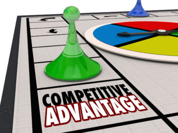 A board game with a green and blue playing piece, a spinning board, and game squares. The focus is on one game square that reads, "Competitive Advantage."