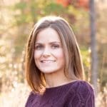 Head shot of Jess Zellmer in a deep purple sweater.